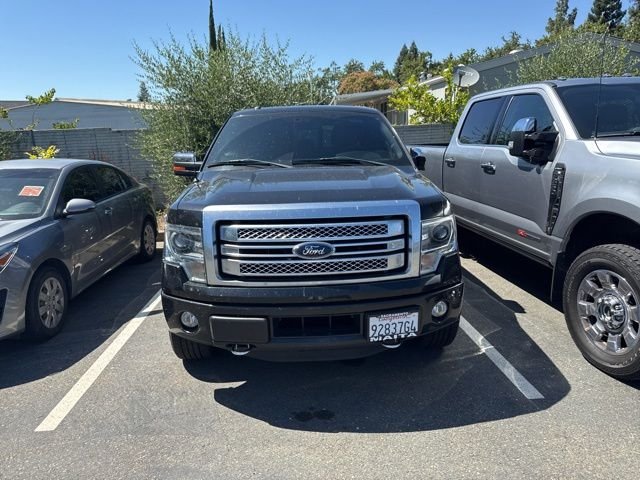 Used 2014 Black Ford Platinum image 1