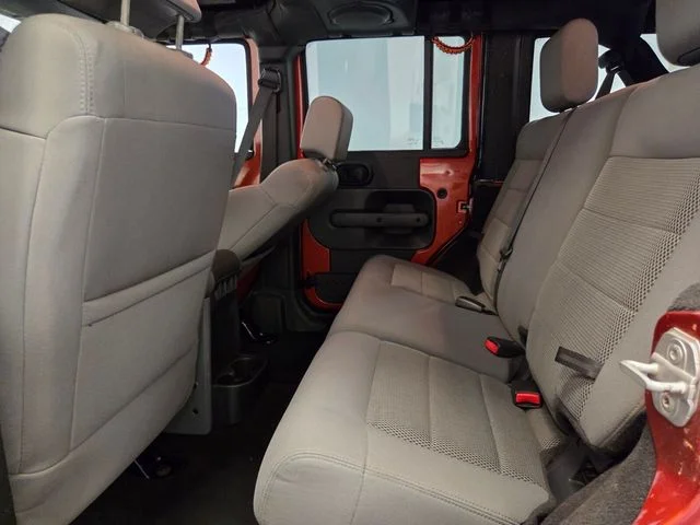 Used 2009 Orange Jeep Unlimited Sahara image 11