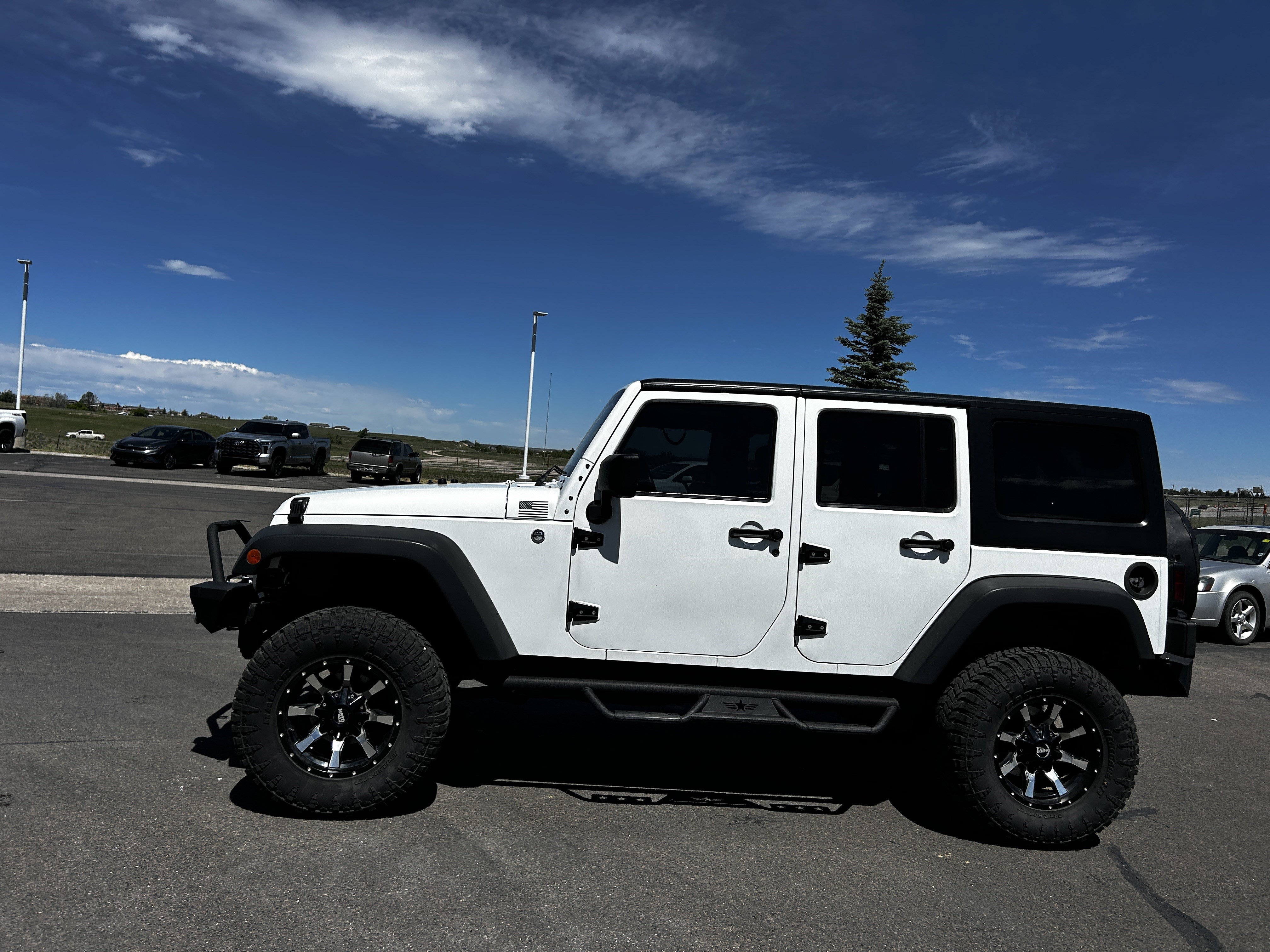 Used 2013 Jeep Wrangler Unlimited Sport with VIN 1C4BJWDG9DL656735 for sale in Cheyenne, WY