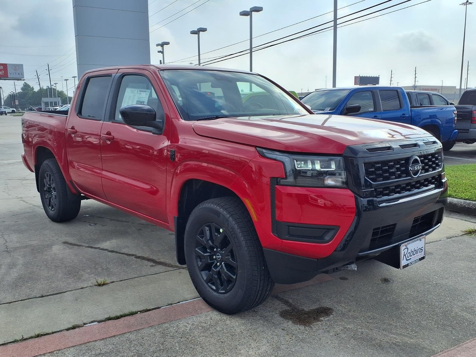 2026 Nissan Frontier SV Red at Robbins Nissan