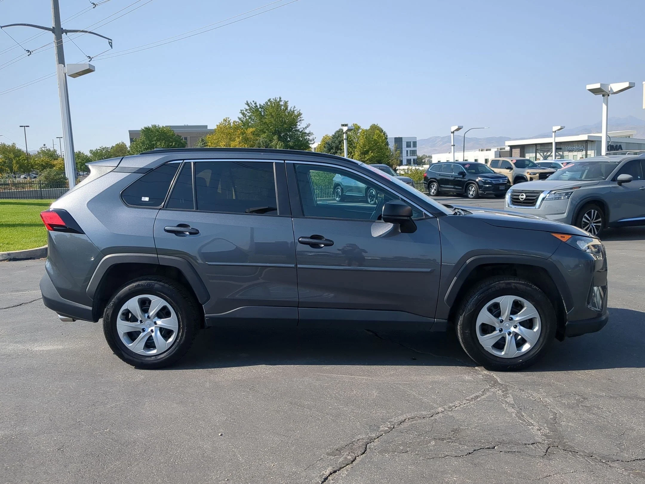 Used 2021 Midnight Black Metallic Toyota LE image 7