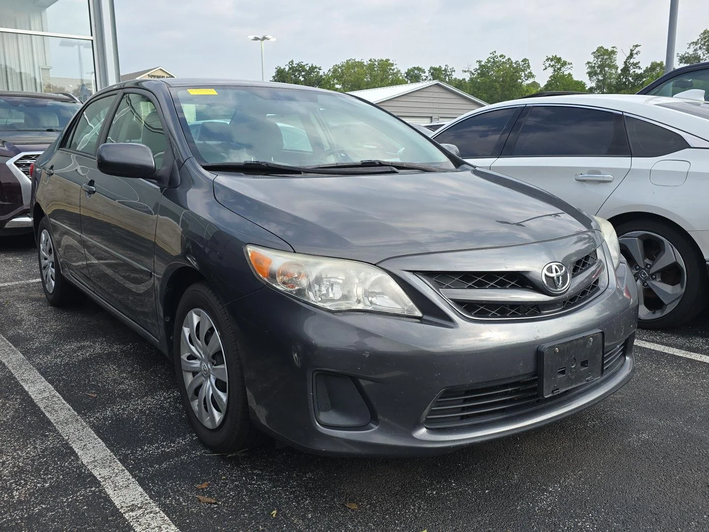 Used 2012 Magnetic Gray Metallic Toyota LE image 1