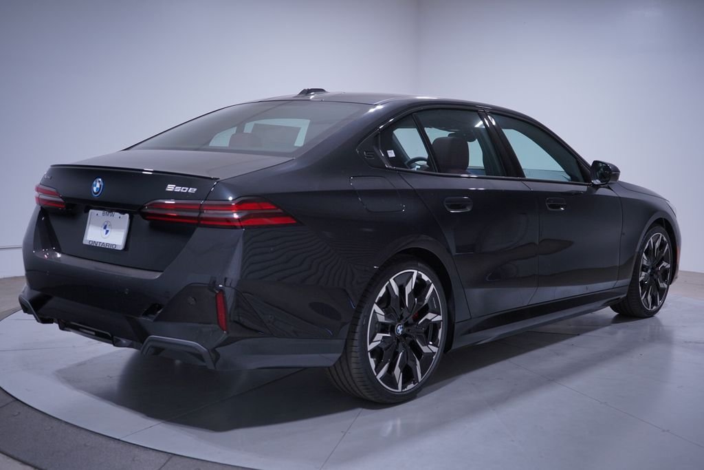 New 2027 Black Sapphire Metallic BMW 550e xDrive image 3