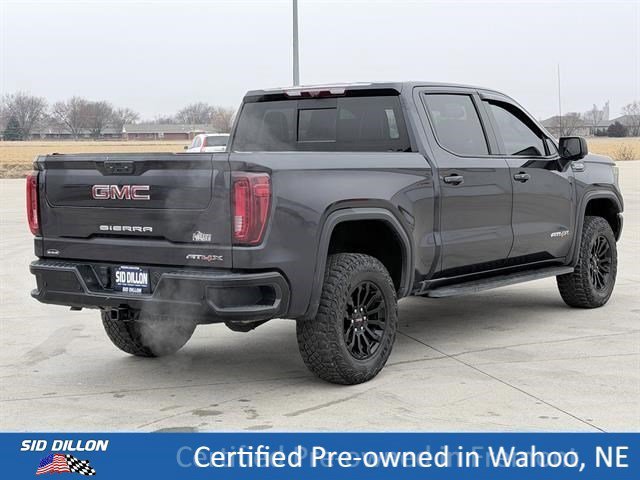 Used 2023 Titanium Rush Metallic GMC AT4X image 4