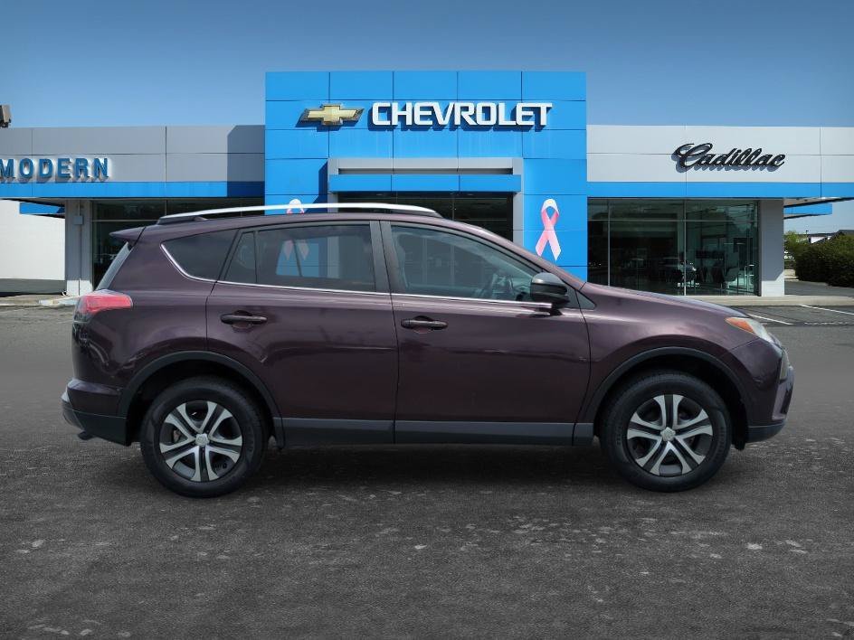 Used 2016 Black Currant Metallic Toyota LE image 6
