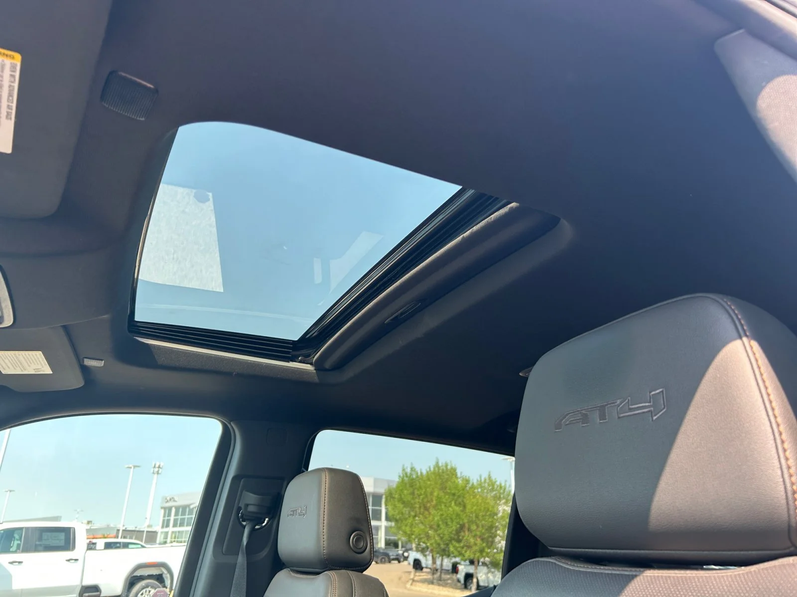 Used 2025 White GMC AT4 Crew Cab 3.0L Leather Sunroof Navigation 4x4 image 18