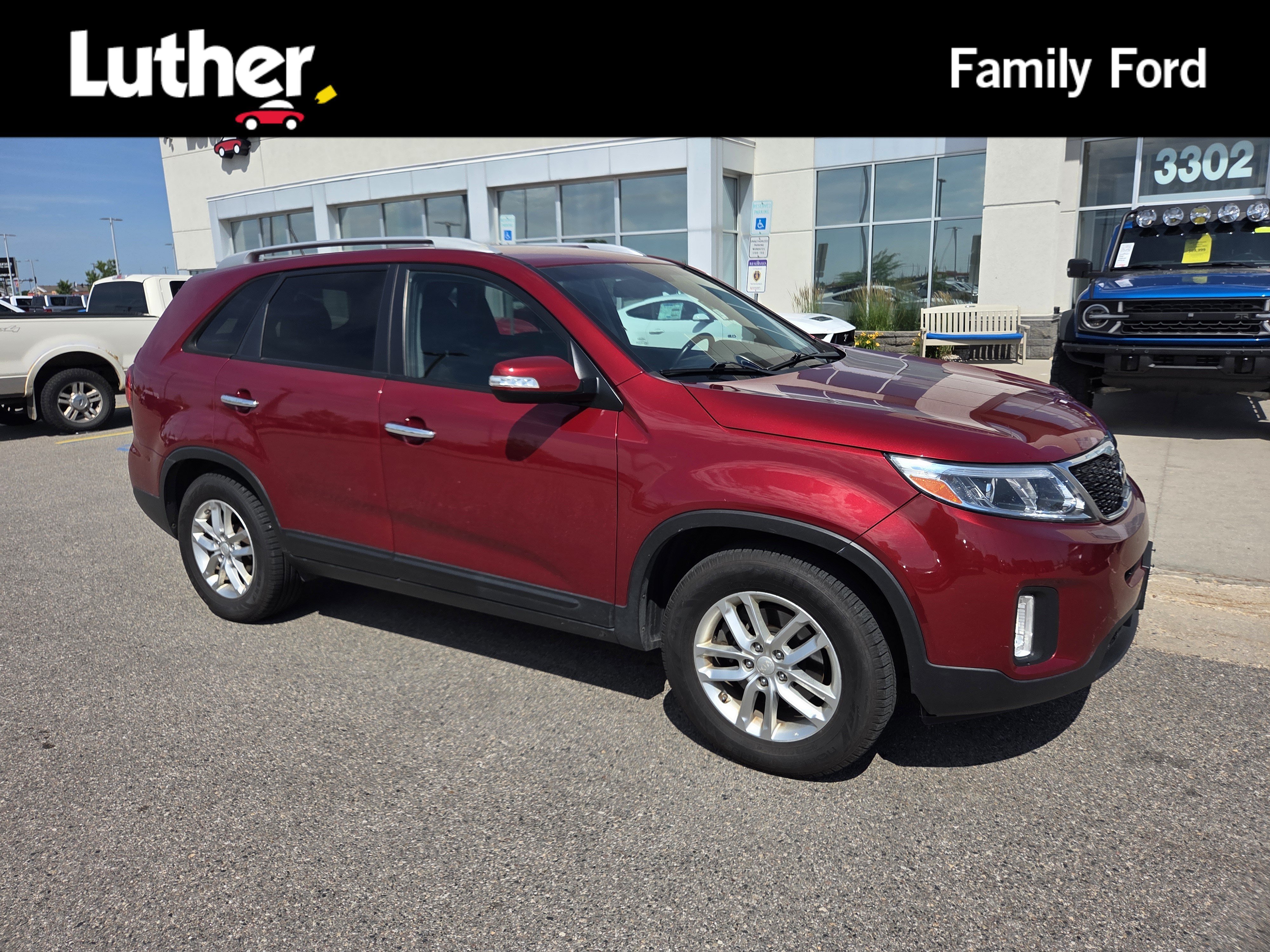 Used 2015 Remington Red Metallic Kia LX image 1