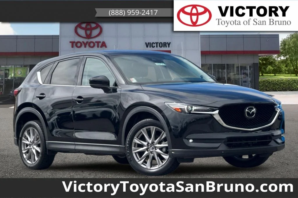 Used 2019 Black Mazda Grand Touring image 1