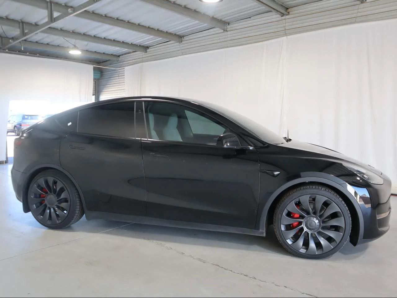 Used 2024 Solid Black Tesla Performance image 4