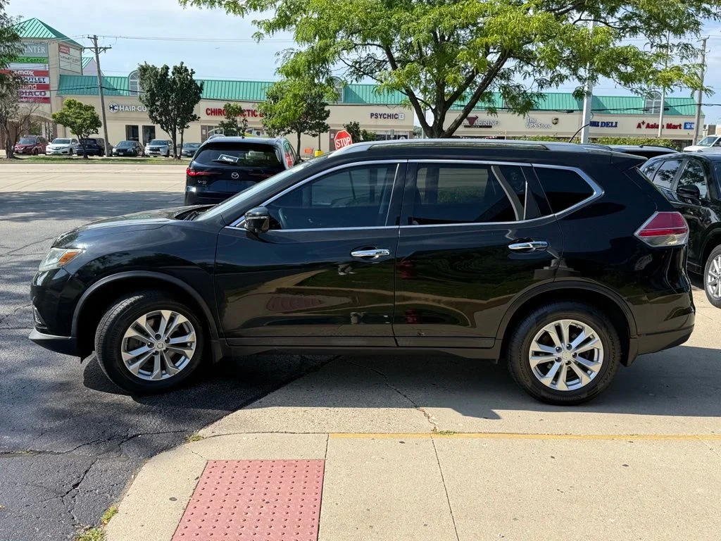 Used 2016 Black Nissan SV image 4
