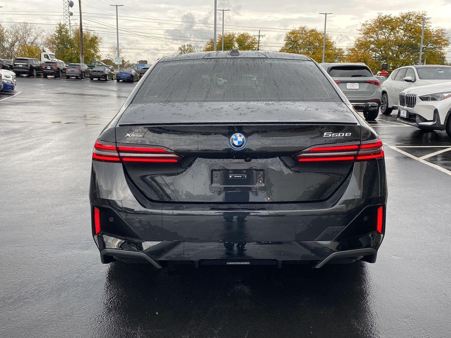 Used 2025 Black Sapphire Metallic BMW 550e xDrive image 4