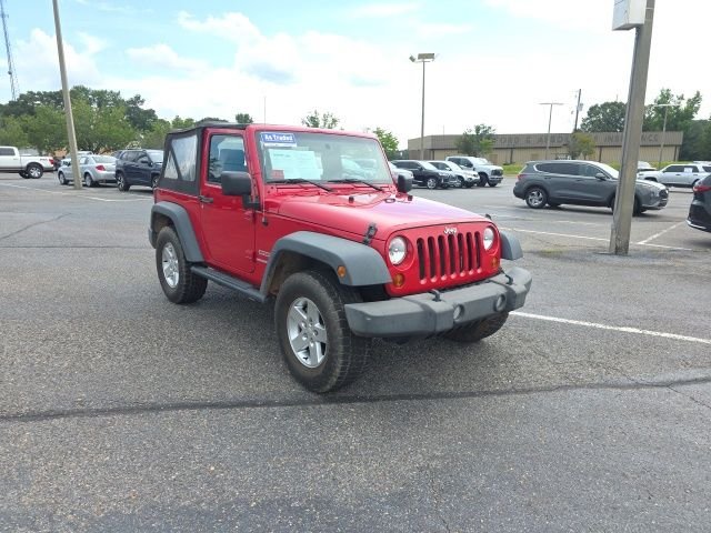Used 2010 Red Jeep Sport image 1
