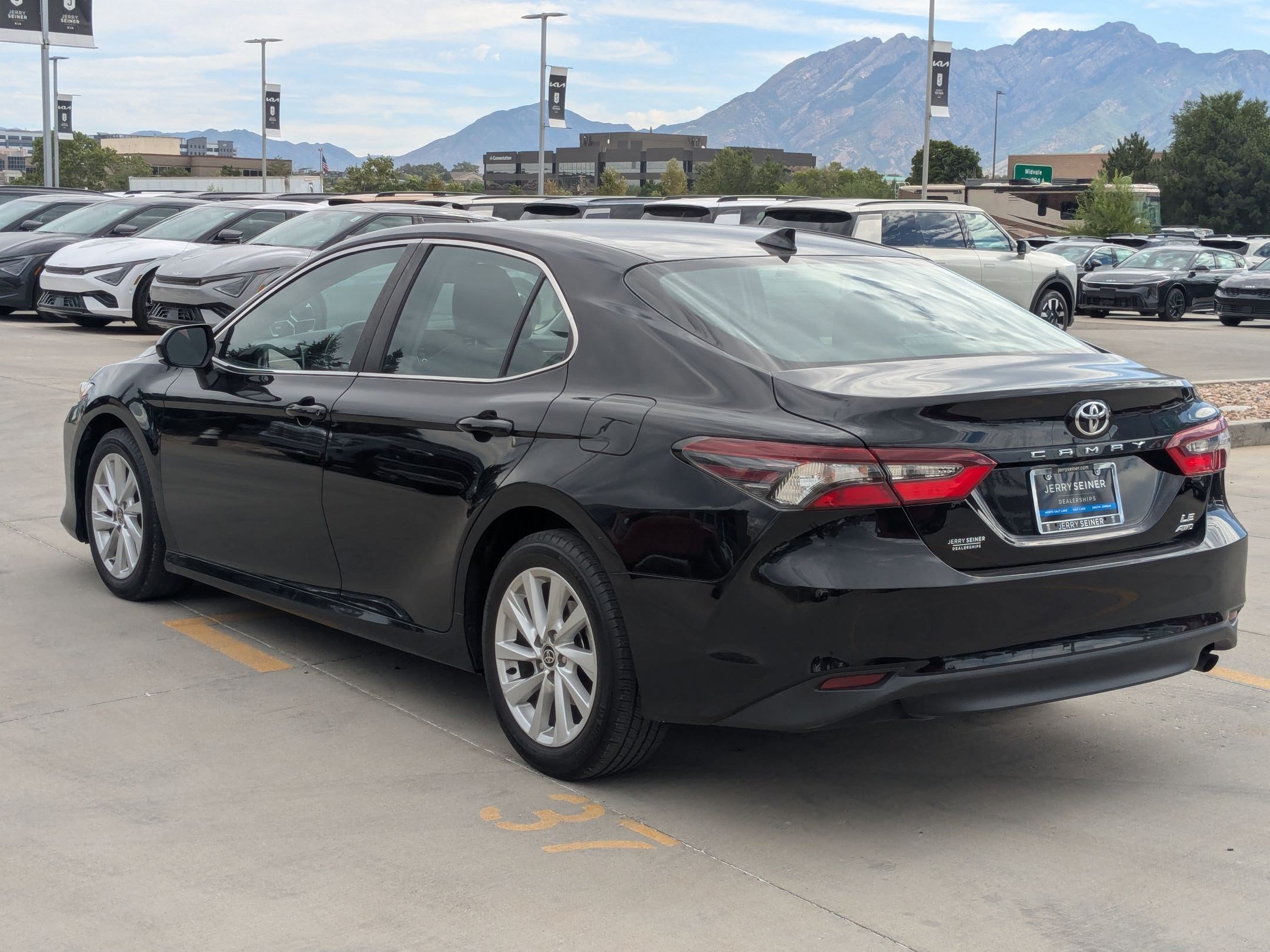 Used 2023 Midnight Black Metallic Toyota LE image 4