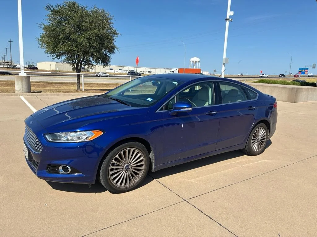 Used 2016 Blue Ford Titanium image 1