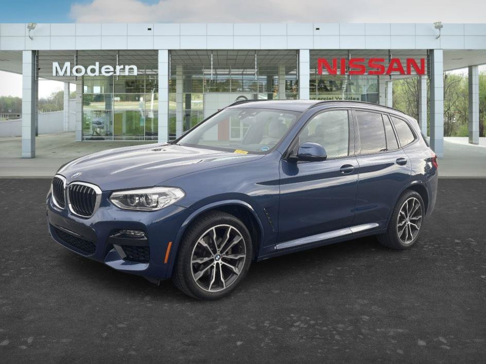 Used 2021 Phytonic Blue Metallic BMW xDrive30i image 1