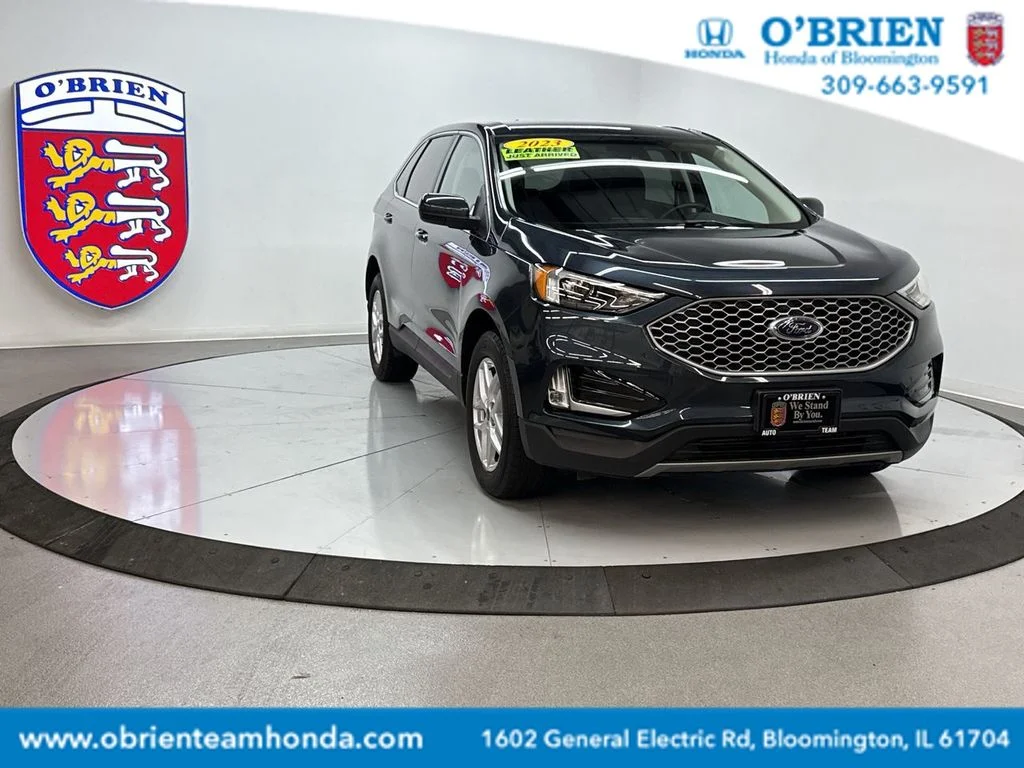Used 2023 Blue Metallic Ford SEL image 1