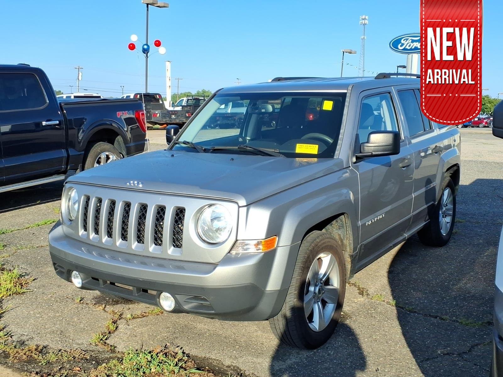 Used 2016 Billet Silver Metallic Clearcoat Jeep Sport image 1