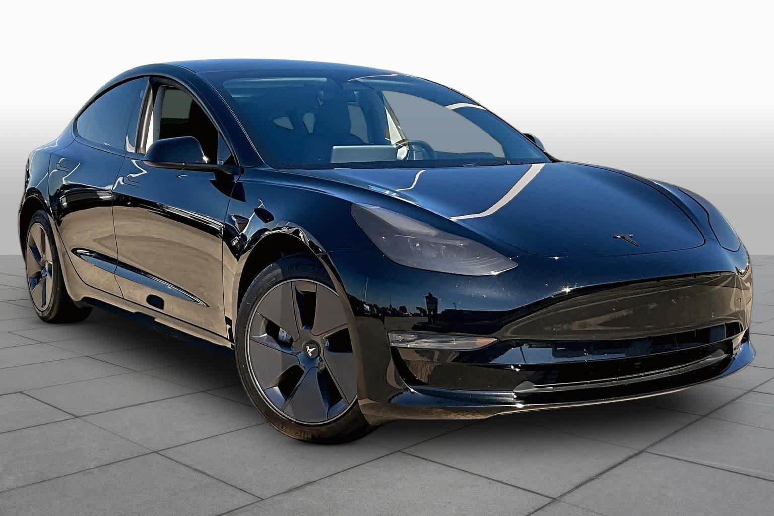 Used 2023 Solid Black Tesla  image 2