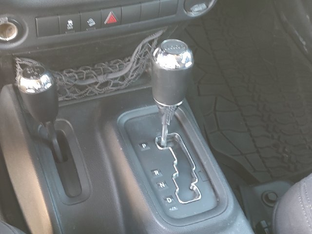 Used 2013 Green Jeep Unlimited Sport image 16