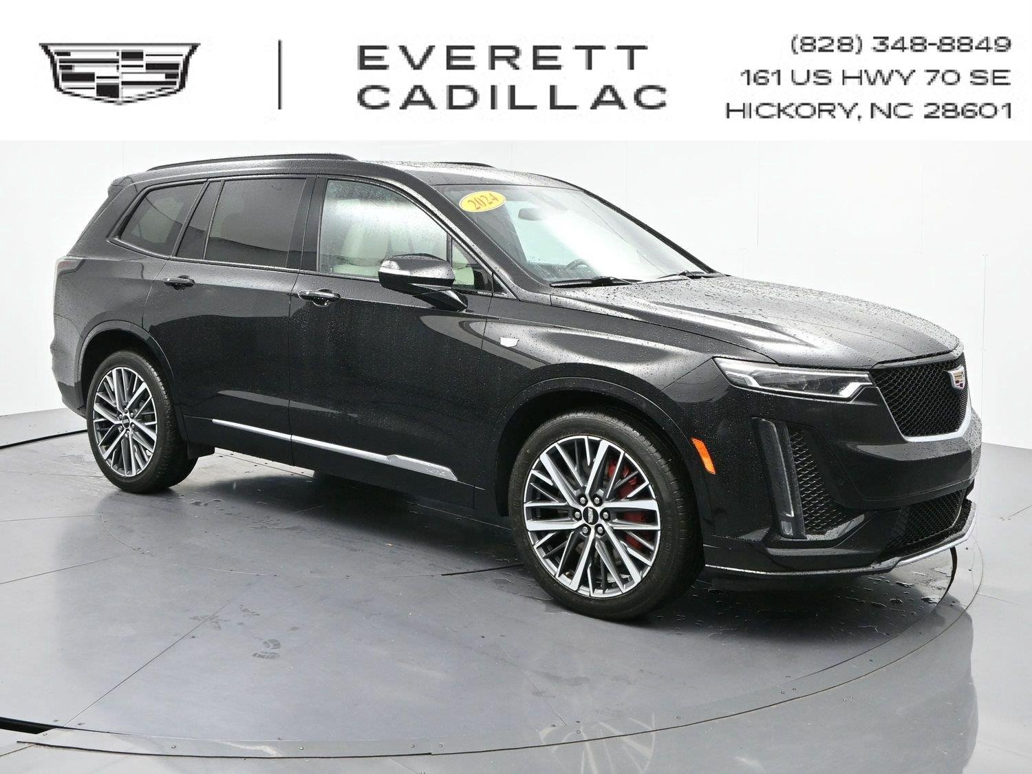 Used 2024 Stellar Black Metallic Cadillac Sport image 1