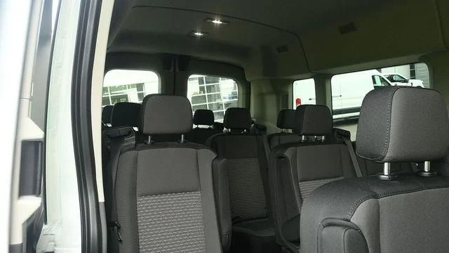 New 2026 Oxford White Ford Passenger Van XLT image 9