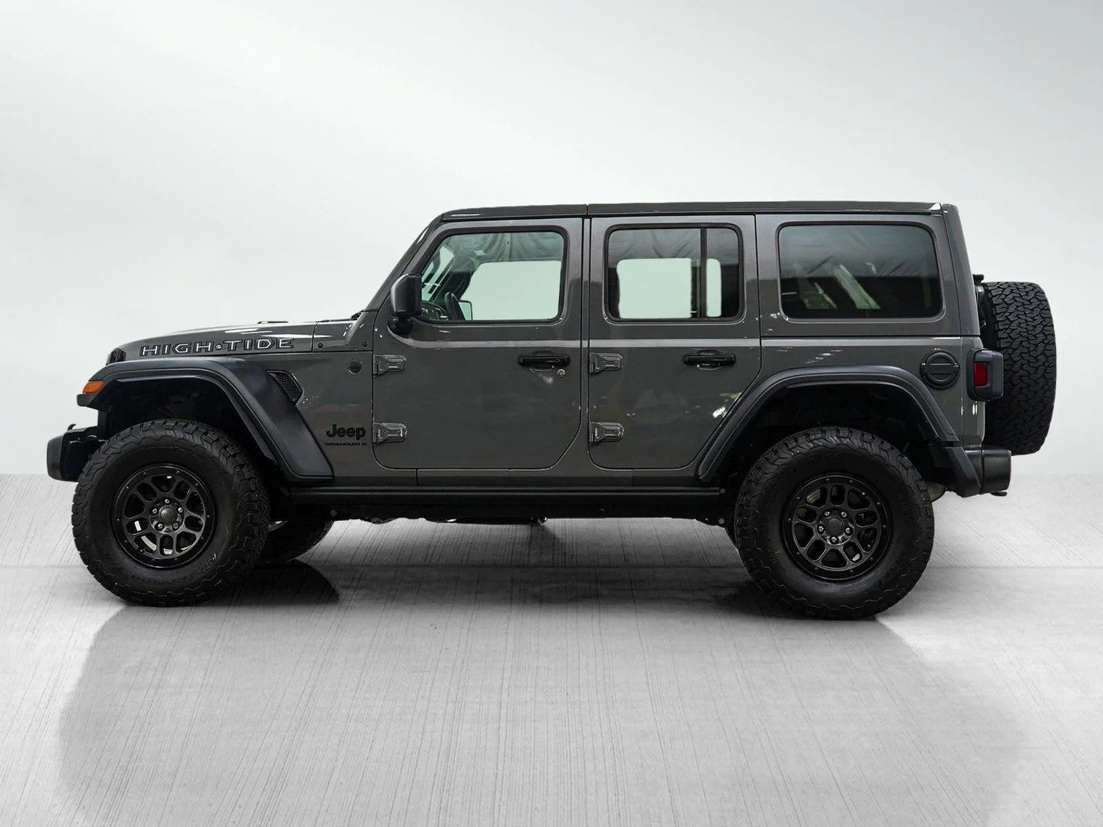 Used 2023 Jeep Wrangler 4-Door High Tide with VIN 1C4HJXDG2PW651900 for sale in Hopkins, Minnesota