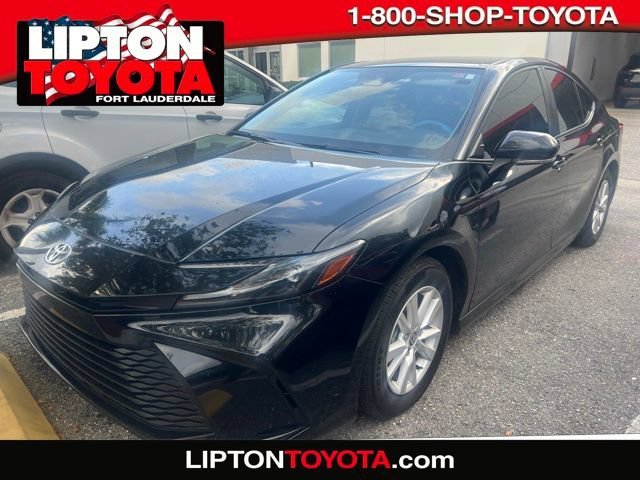 Used 2025 Midnight Black Metallic Toyota LE image 1