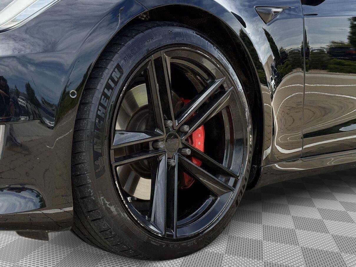 Used 2021 Solid Black Tesla Performance image 8