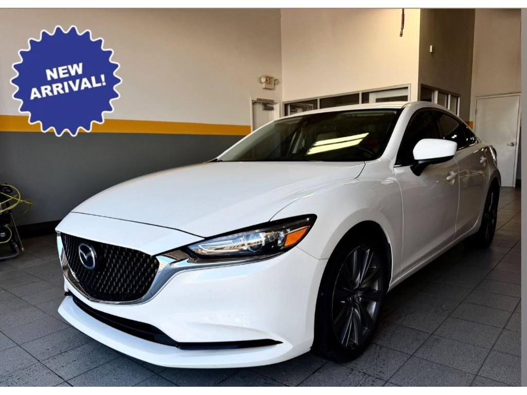Used 2021 Snowflake White Pearl Mica Mazda Touring image 1