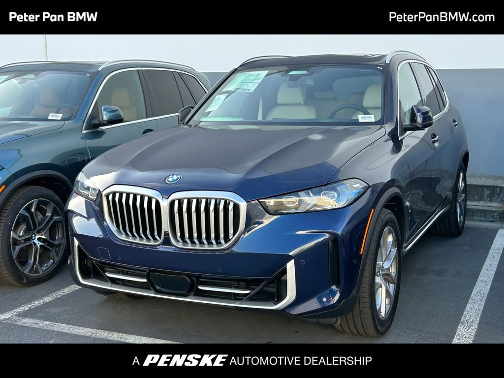 New 2026 Tanzanite Blue II Metallic BMW xDrive50e image 1