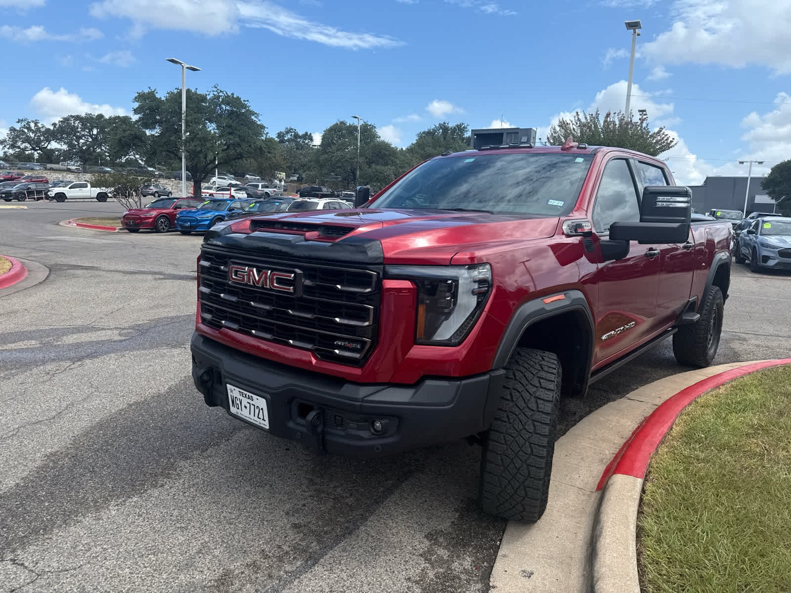 Used 2025 Volcanic Red Tintcoat GMC AT4X image 2
