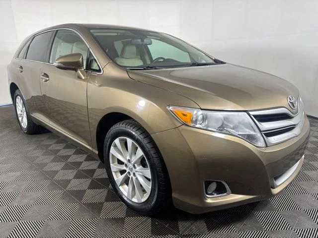 Used 2014 Gold Toyota LE image 1