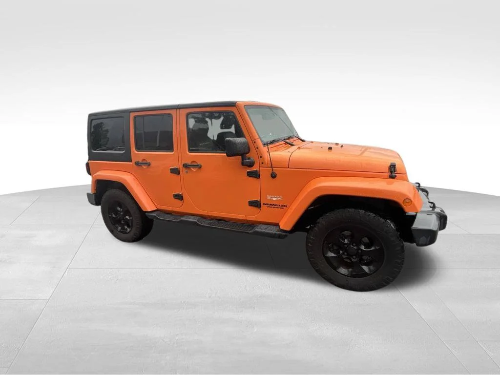 Used 2013 Orange Jeep Unlimited Sahara image 18