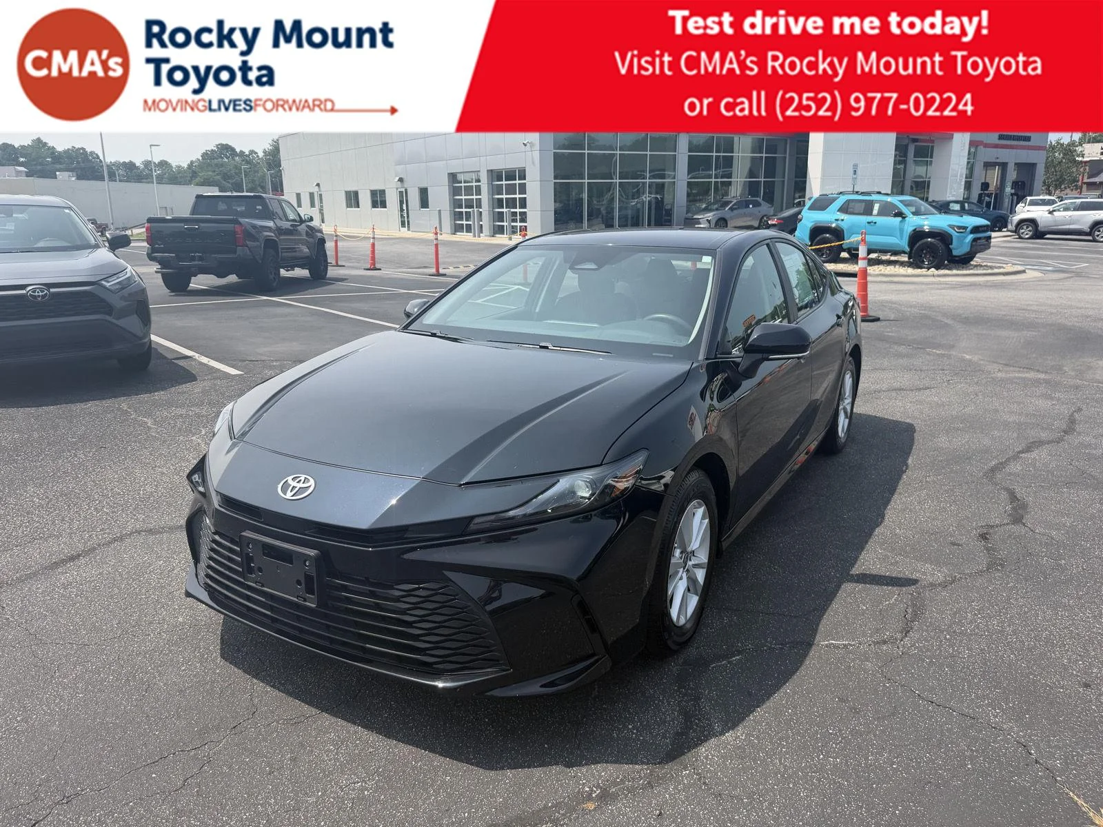 Used 2025 Midnight Black Metallic Toyota LE image 1