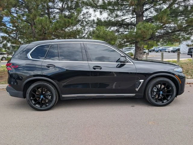Used 2025 Black Sapphire Metallic BMW xDrive50e image 2
