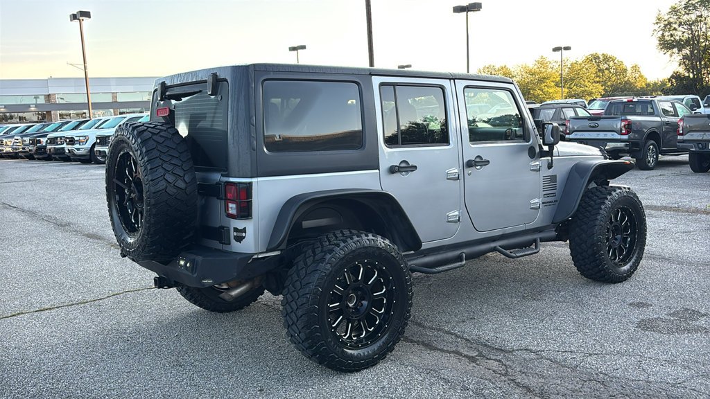 Used 2013 Billet Clearcoat Metallic Jeep Unlimited Sport image 23