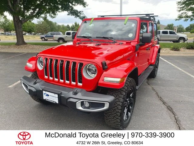 Used 2021 Red Jeep Unlimited Sahara 4xe image 1