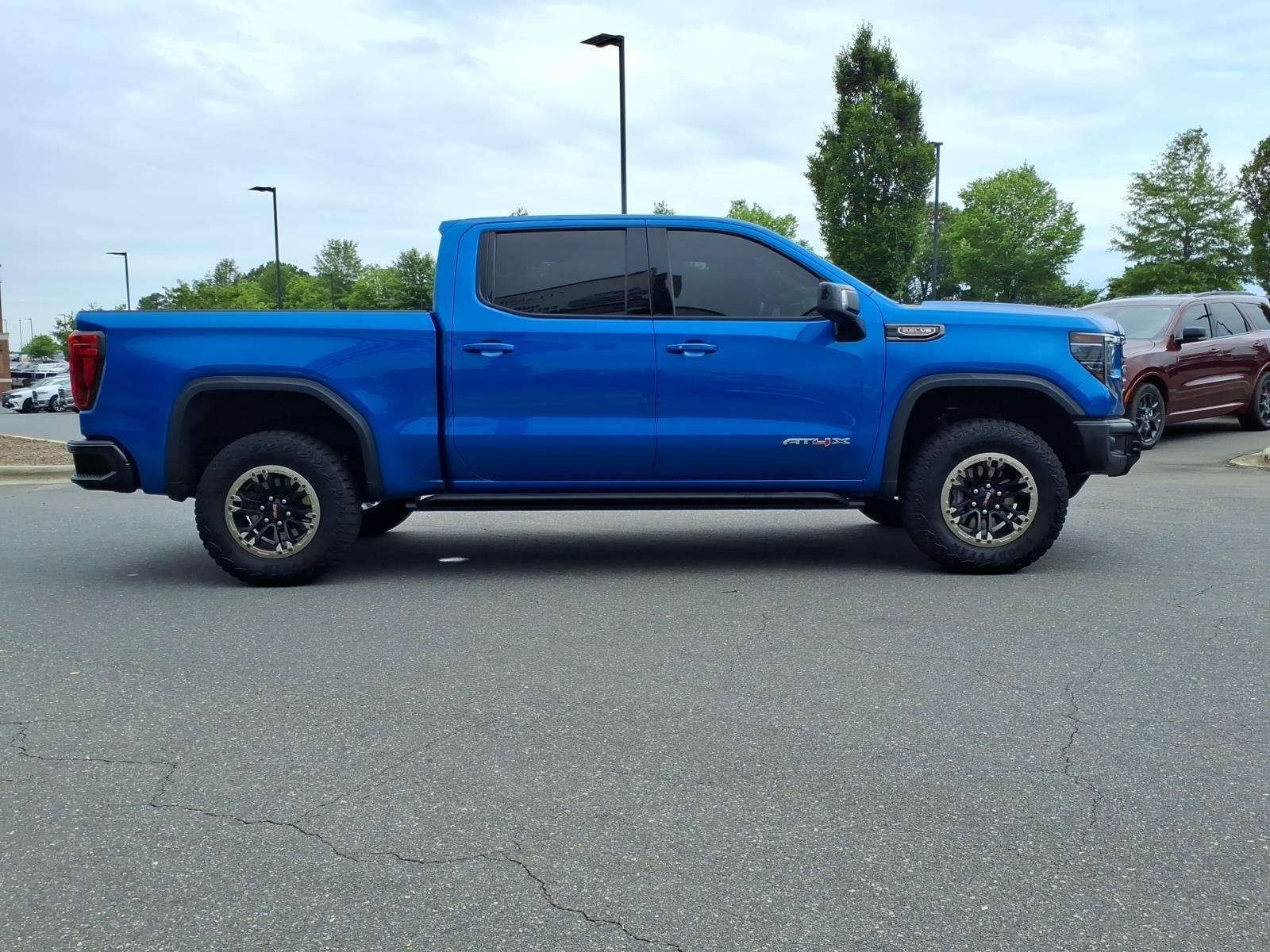 Used 2024 Dynamic Blue Metallic GMC AT4X image 11