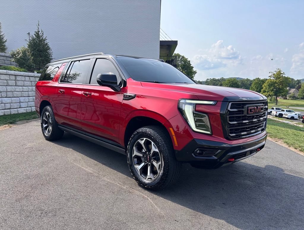 Used 2025 Volcanic Red Tintcoat GMC AT4 Ultimate image 1