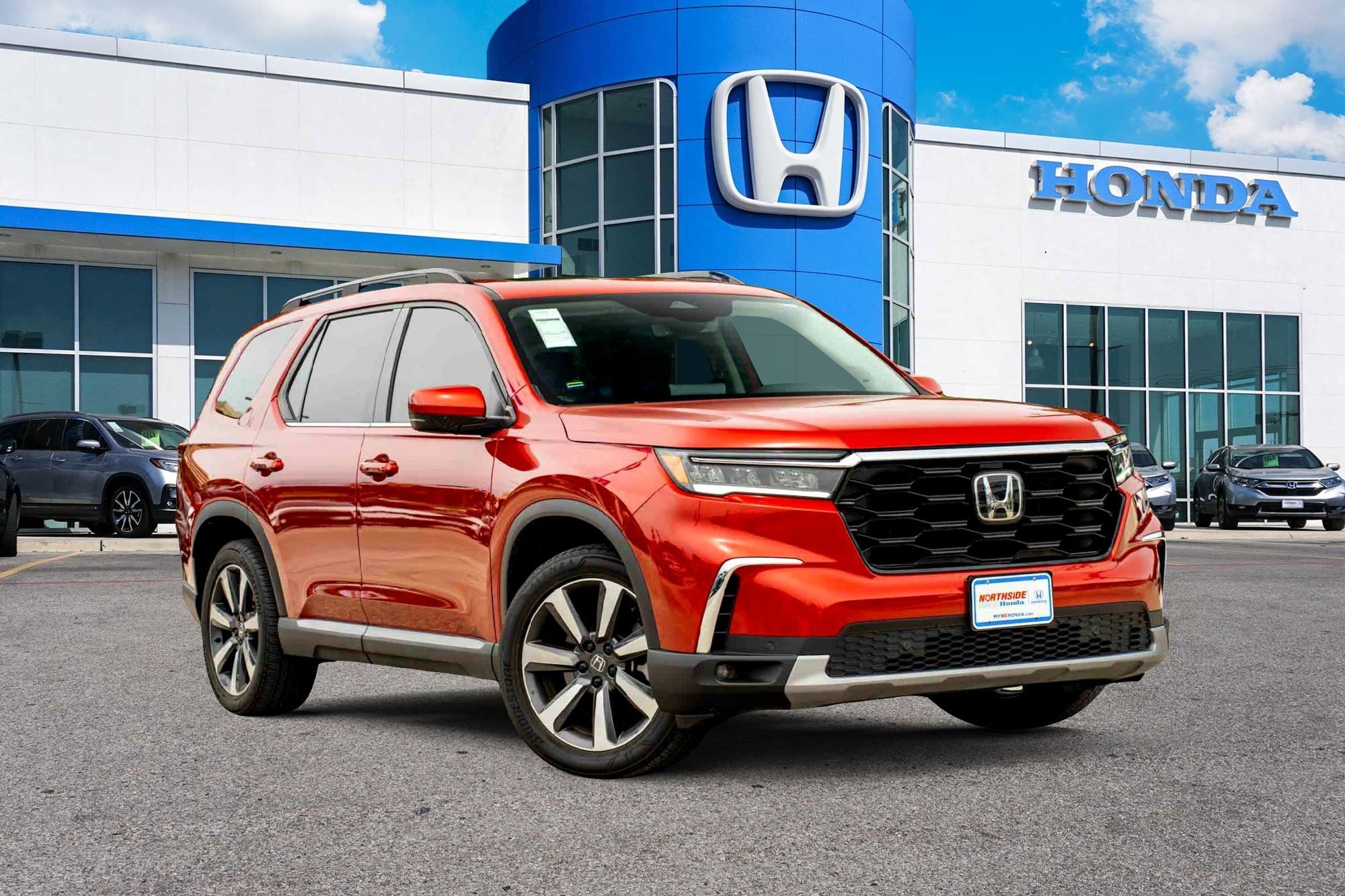 Used 2024 Radiant Red Metallic II Honda Touring image 1