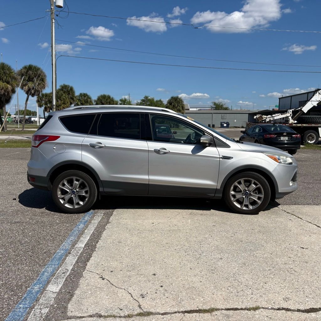 Used 2014 Ford Escape Titanium with VIN 1FMCU0J96EUE49497 for sale in Tampa, FL