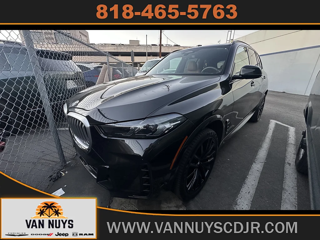 Used 2024 Black Sapphire Metallic BMW sDrive40i image 1