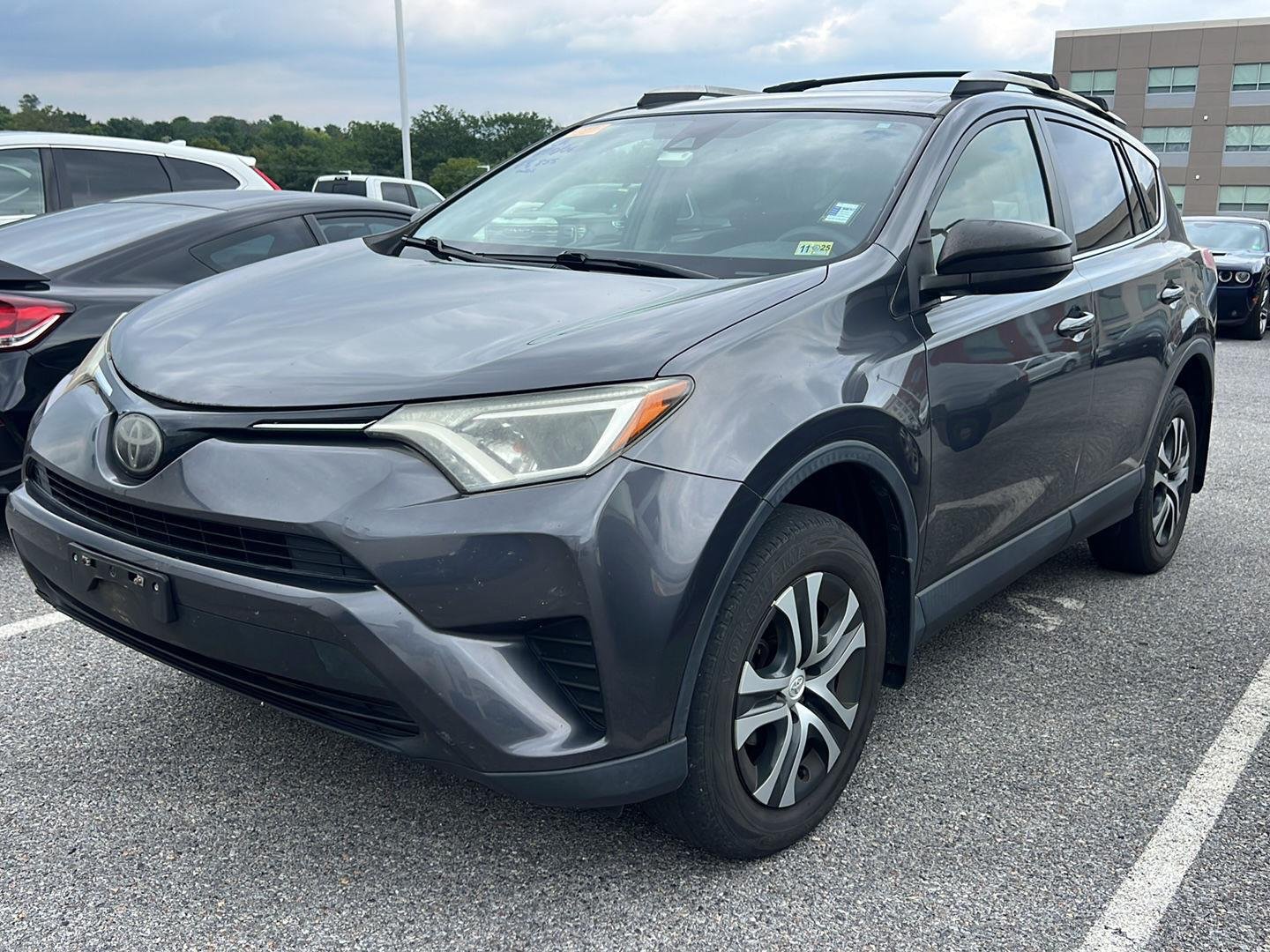 Used 2018 Magnetic Gray Metallic Toyota LE image 1