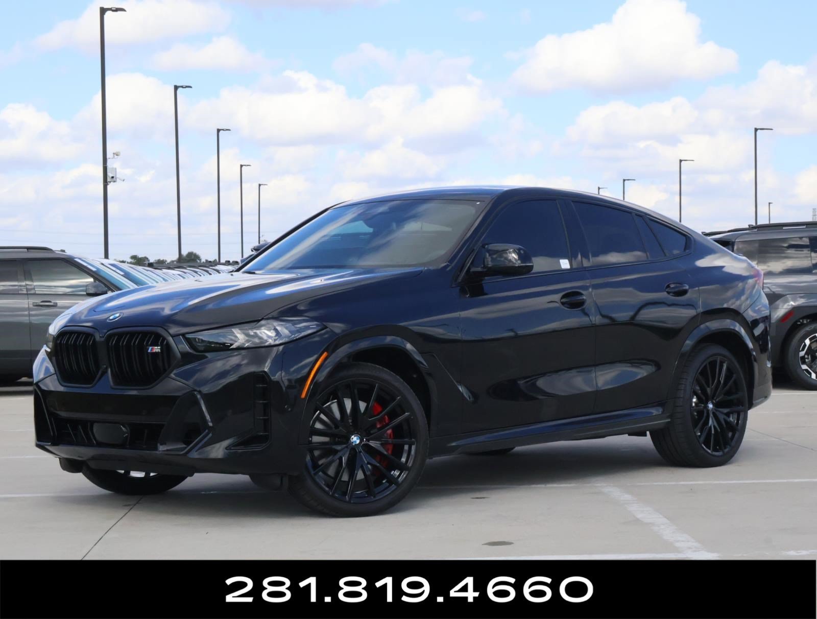 Used 2025 Black Sapphire Metallic BMW M60i image 1