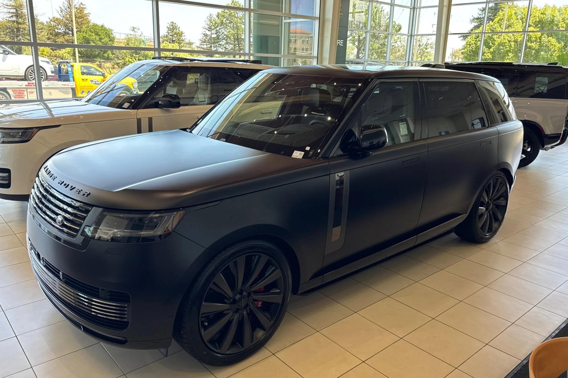 New 2026 Obsidian Black Satin Land Rover SV image 1