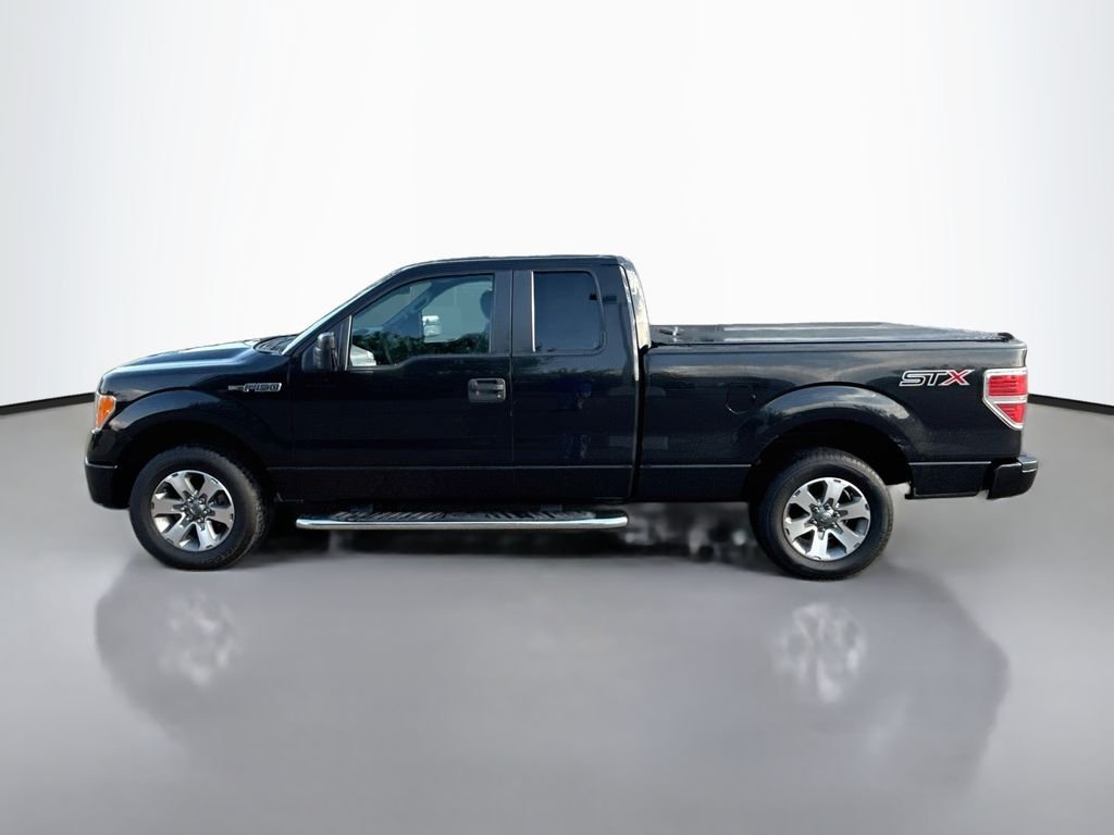 Used 2014 TUXEDO BLACK METALLIC Ford STX image 4