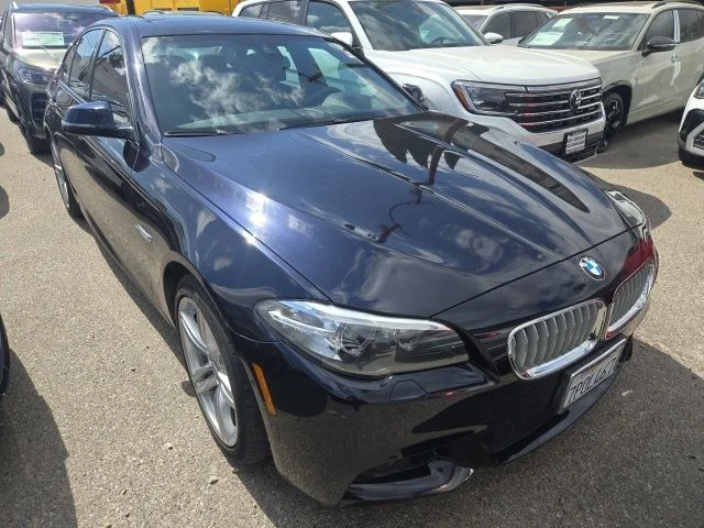 Used 2014 Black BMW 550i xDrive image 1