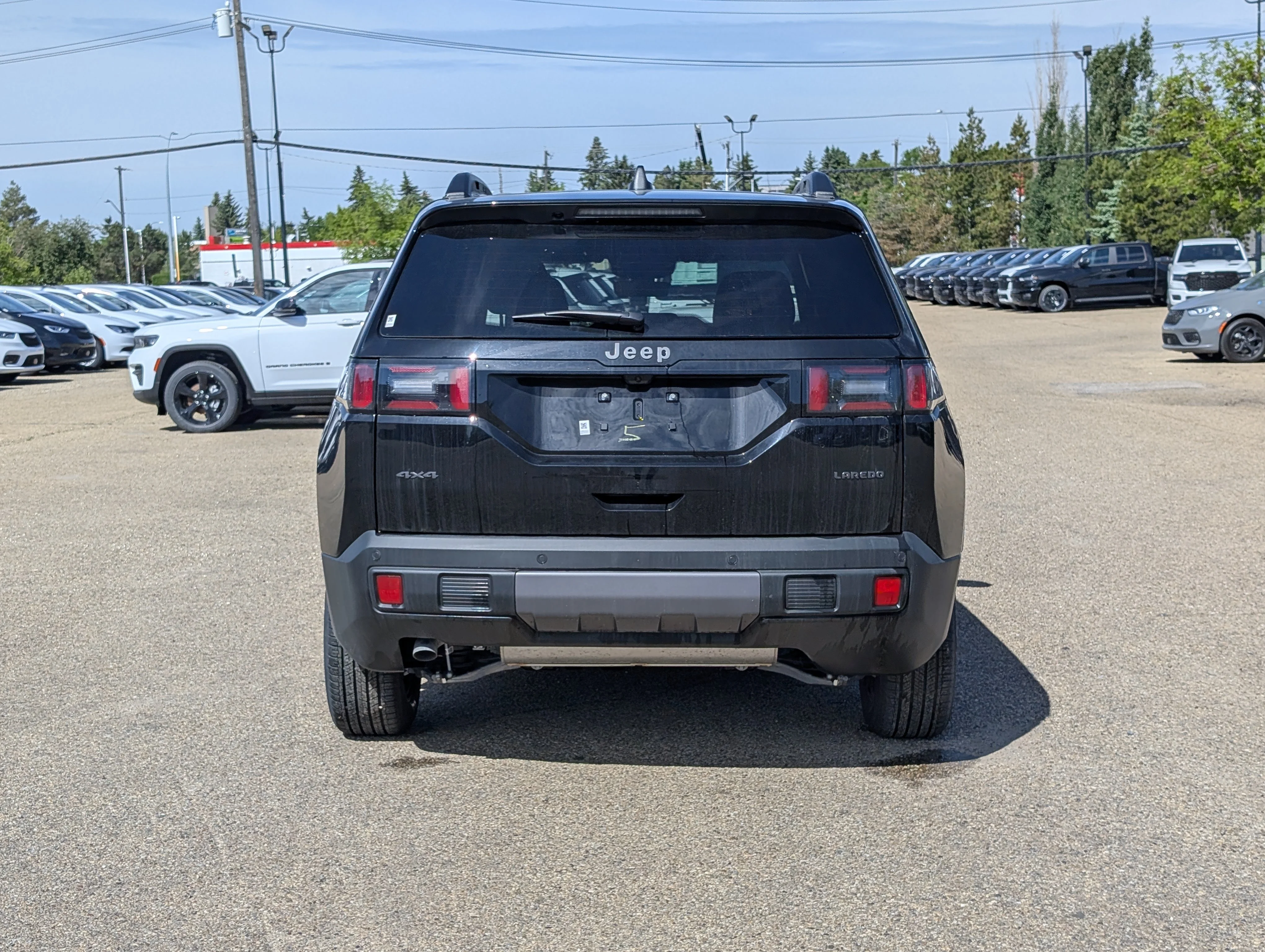 New 2026 Diamond Black Crystal Pearl Jeep Laredo image 5