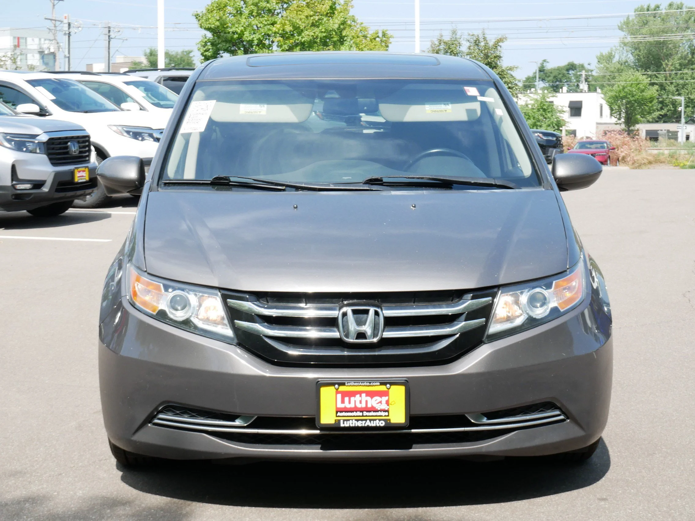 Used 2014 Honda Odyssey EX-L with VIN 5FNRL5H66EB052861 for sale in Hopkins, Minnesota
