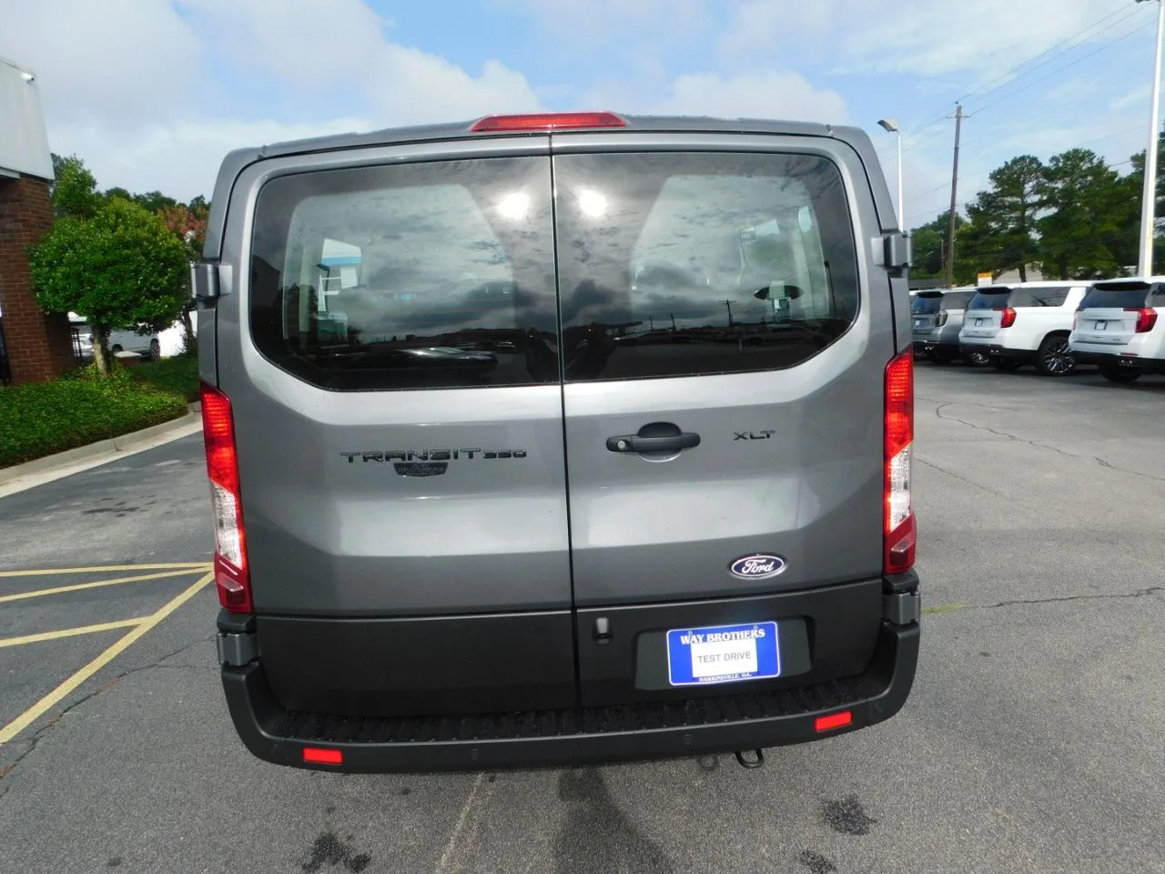 New 2026 Carbonized Gray Metallic Ford Passenger Van XLT image 7